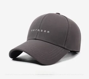 Detail of grey baseball cap showing narason embroidery and premium twill fabric texture