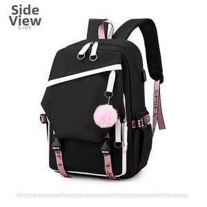 Side view of student backpack in black and pink with plush ball and side bottle pocket