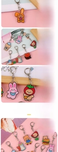 Detailed macro view of cute acrylic animal charms with colorful digital printing details