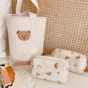 Detailed embroidery of bears, moons and stars on quilted cotton storage bags set