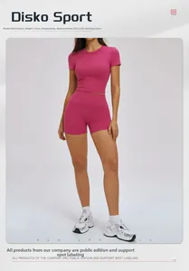 Close-up of rose pink yoga set with tight t-shirt and high waist shorts on a model