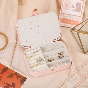 Pink PU leather travel jewelry box with velvet lining and earring organizer board