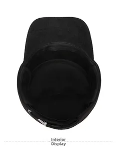 Detail of the thick fleece lining and durable stitching inside the black wool flat cap