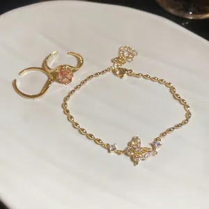 18k gold plated jewelry set featuring butterfly charm bracelet and gemstone rings