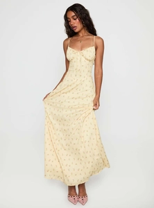 Detail of light yellow floral sundress with drawstring chest and flowing hem for summer
