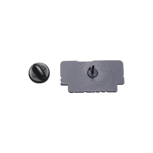 Detail view of black enamel pin back with single pin post and black rubber clutch backing