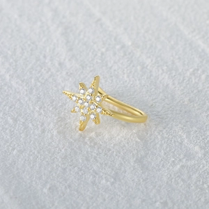 Detail of gold-plated North Star ear cuff with shimmering pavé set white zirconia crystals