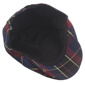Detailed interior view of plaid ivy cap showing black lining and care label tag