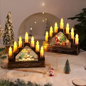 Vintage LED Christmas candle bridge with Santa Claus miniature scene and festive snow decor