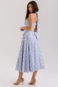 Detail view of light blue floral dress with halter neck tie and open back design