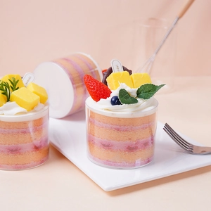Realistic mousse cake cup model with cream and fruits on a white porcelain plate
