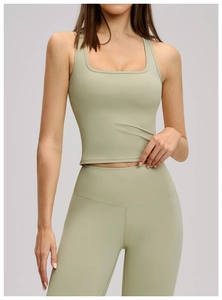Detail of sage green moisture-wicking yoga set showing fabric texture and square neck design