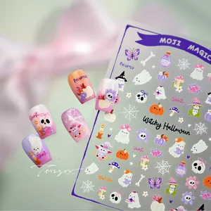 Macro detail of Halloween nail stickers with ghost and pumpkin patterns on display tips