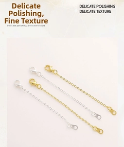 Detail of 14K gold-filled lobster clasps and extension chains for jewelry making