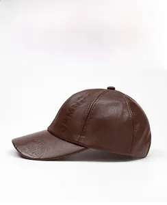 Detail of JAMONT 1985 embossed logo on brown PU leather winter baseball cap