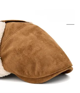 Close-up of brown suede beret featuring foldable wide brim and soft faux lamb wool lining