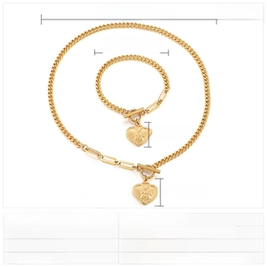 Detail showing gold titanium steel heart necklace and bracelet set with size specifications