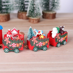 Macro detail of wooden Christmas train with snowman and festive bear ornaments