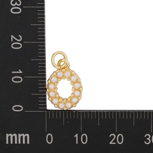 Detailed view of gold letter O pendant with pearls measuring 15mm by 12mm on ruler
