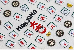 Detailed view of 5D Mahjong nail art stickers featuring traditional tiles and gold motifs