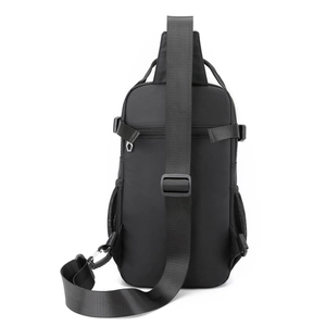 Back view of black nylon crossbody bag with breathable mesh padding and adjustable strap