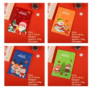 Detailed view of A5 Christmas notebooks showing dimensions 20.5x14cm and colorful covers