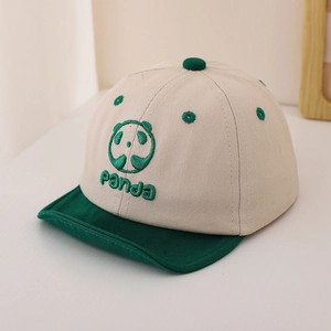 Detail of baby panda baseball cap featuring cotton twill texture and green embroidery