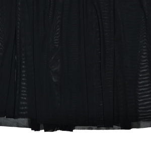 Detail of elegant black mesh fabric showing delicate semi-transparent mesh texture and ruffles