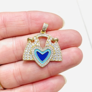 Golden heart-shaped arrow pendant featuring blue evil eye enamel and micro zircon inlay