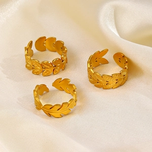 Detailed close-up of 18K gold plated leaf rings with intricate vein texture and adjustable bands