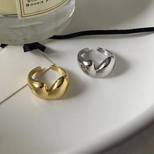 Minimalist gold and silver open heart rings with organic shape and mirror finish
