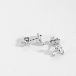 Close-up of S925 sterling silver bee stud earrings with sparkling zircon crystals