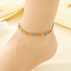 Bohemian gold chain anklet with colorful resin leaf charms worn on female ankle