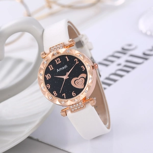 Close-up of Amadi quartz watch featuring star-dial with heart patterns and crystal bezel
