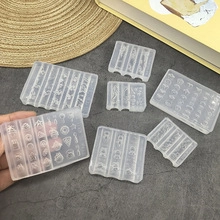 Detail view of translucent silicone nail art molds with diverse 3D patterns for manicure