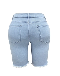 Detailed back view of light blue denim shorts featuring retro washing and frayed raw hem edges