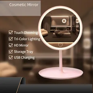 Pink LED makeup mirror with three light modes and a storage base on a tabletop