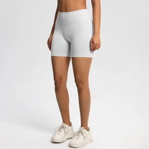 Detail of high-waisted seamless athletic shorts in light grey showing fabric texture