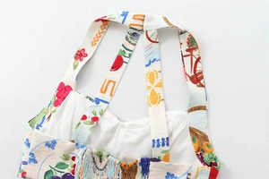 Detail of floral print halter top showing elastic shirred back and colorful artistic patterns