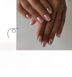 Detail of short square press-on nails in pearlescent pink with metallic gloss finish