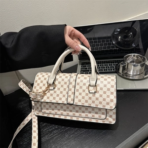 Chic cream-white crossbody bag with vintage brown floral pattern and golden hardware