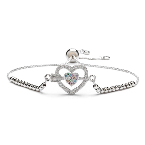 Detail of adjustable silver bracelet with pavé heart and colorful arrow charm pendant