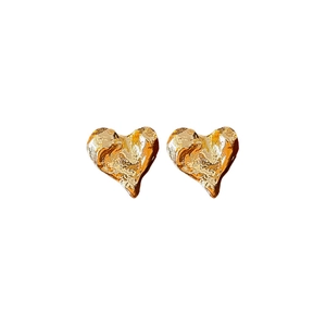 Minimalist heart-shaped golden metal stud earrings with textured crumpled surface