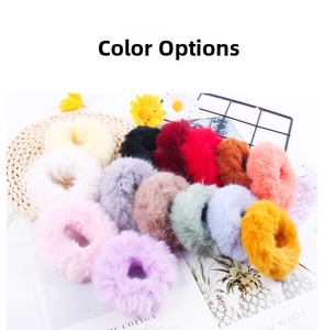 Flat lay of soft plush hair scrunchies in 14 colors including pink, purple and red