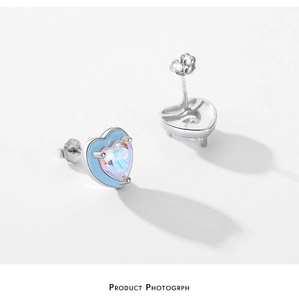 Macro view of S925 silver heart stud earrings with aurora gemstone and blue enamel