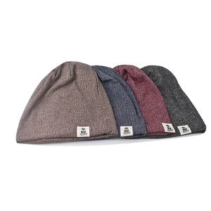 Set of 4 knitted beanies in coffee, blue, burgundy, and grey with letter embroidery labels