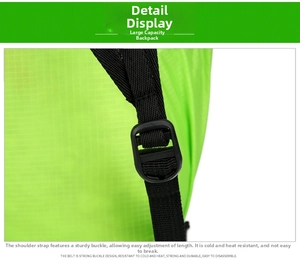 Detail view of durable black nylon shoulder straps and adjustable buckles on the green backpack