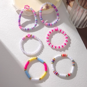 Set of 6 colorful clay flower and pearl bracelets with beach theme shells and metal charms