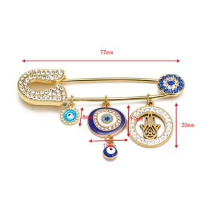 Detailed size specifications of the gold Hamsa hand and evil eye safety pin brooch