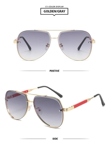 Detail view showing front and side of golden pilot sunglasses with gray gradient lenses